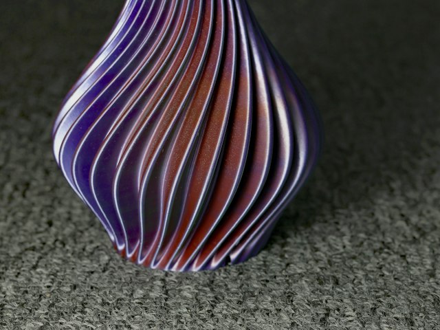 3D printed twisted vase in purple and pink