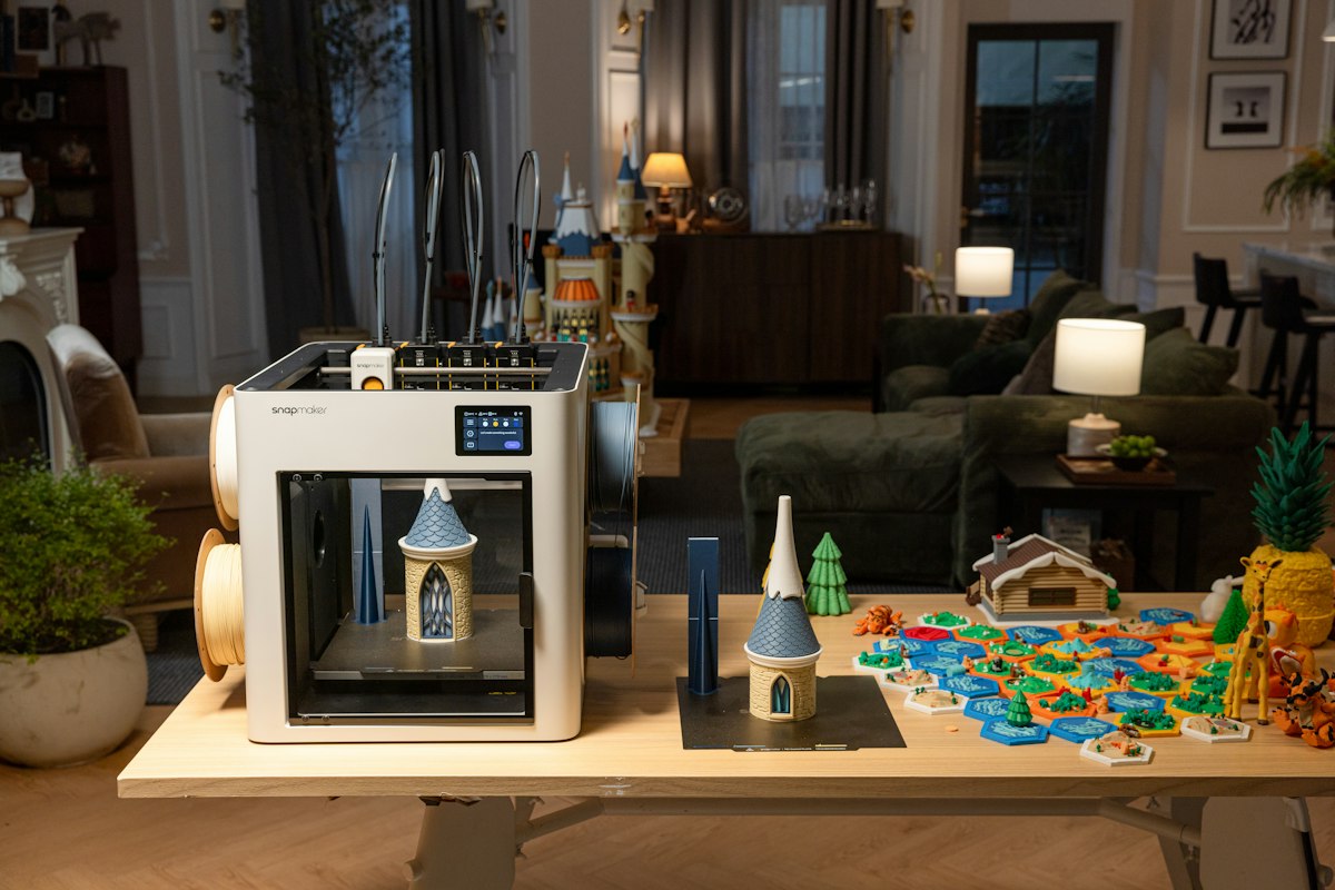 Snapmaker U1 3D printer building a miniature castle layer by layer