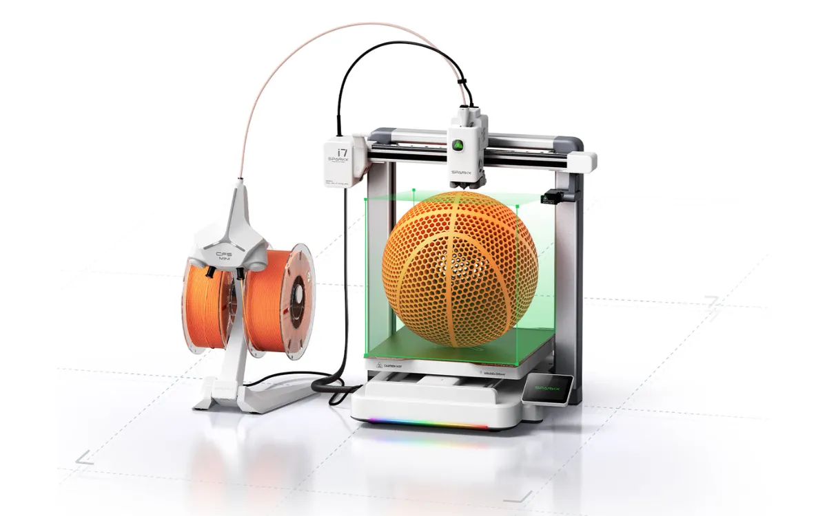 Creality SparkX i7 printing an orange lattice basketball that fills most of its 260 by 260 by 255 mm build volume